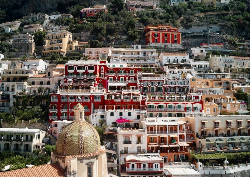 Le Sirenuse’s ‘Pompeii red’ facade greets you as you arrive into Positano by boat (Courtesy of Le Sirenuse Photographer/Credit Brechenmacher & Baumann)