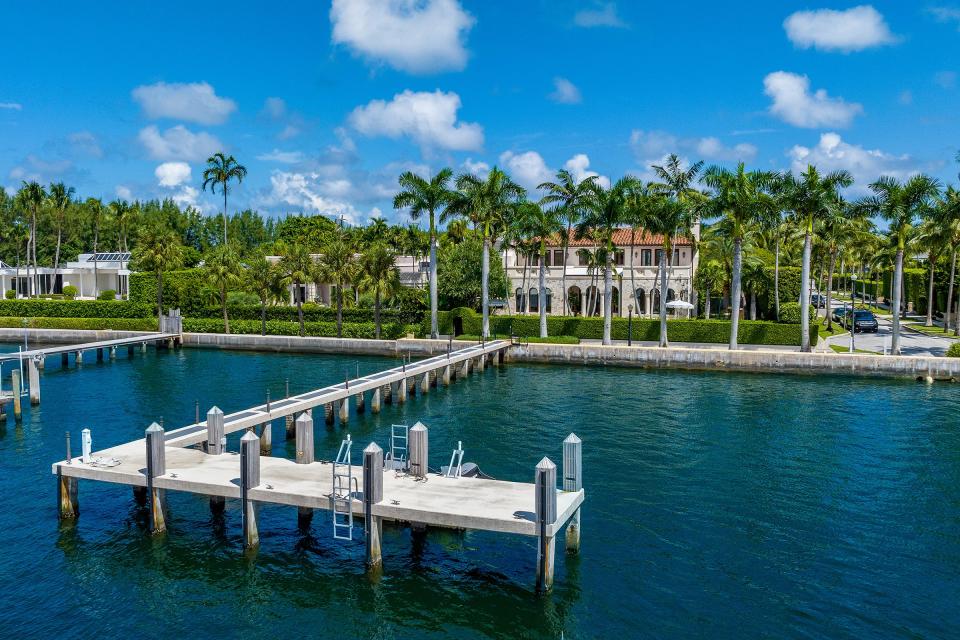 An L-shaped dock stretches into the Intracoastal Waterway at the Hilfigers’ house at 313 Dunbar Road. The property faces about 100 feet of lake frontage.