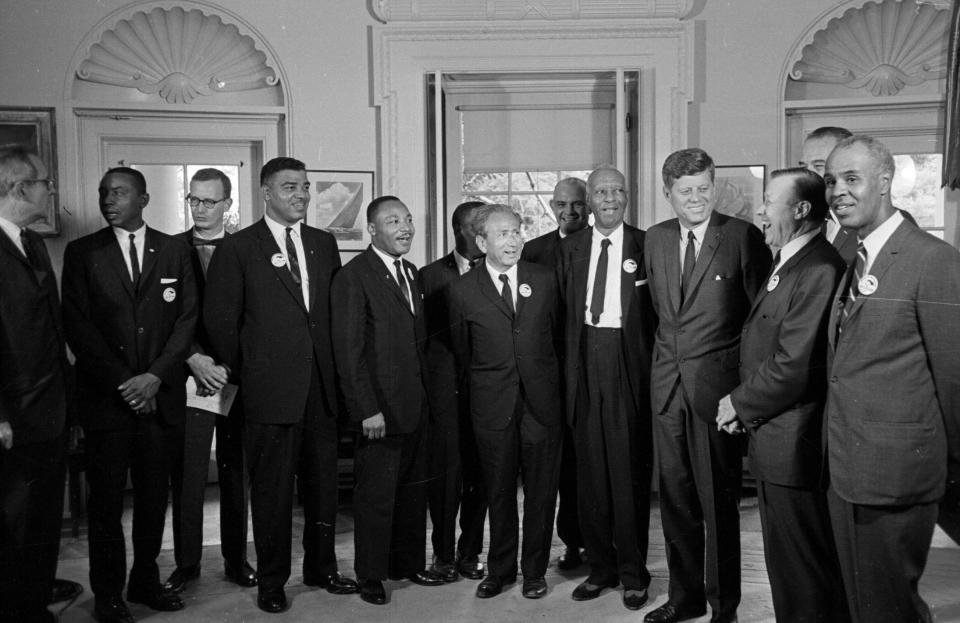 President Kennedy poses August 28, 1963 at the White House with a group of leaders of the March on Washington.  From left, Whitney Young, National Urban League; Dr. Martin Luther King, Christian Leadership Conference; John Lewis, Student Non-violent Coordinating Committee;  Rabbi Joachim Prinz, American Jewish Congress; Dr. Eugene P. Donnaly, National Council of Churches; A. Philip Randolph, AFL-CIO vice president; Kennedy; Walter Reuther, United Auto Workers; Vice-President Johnson, rear, and Roy Wilkins, NAACP.