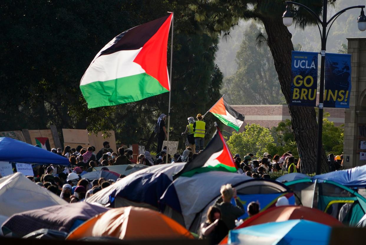 Flags wave over a pro-Palestinian encampment on May 1, 2024 at the campus of UCLA, which drew hundreds of protesters.