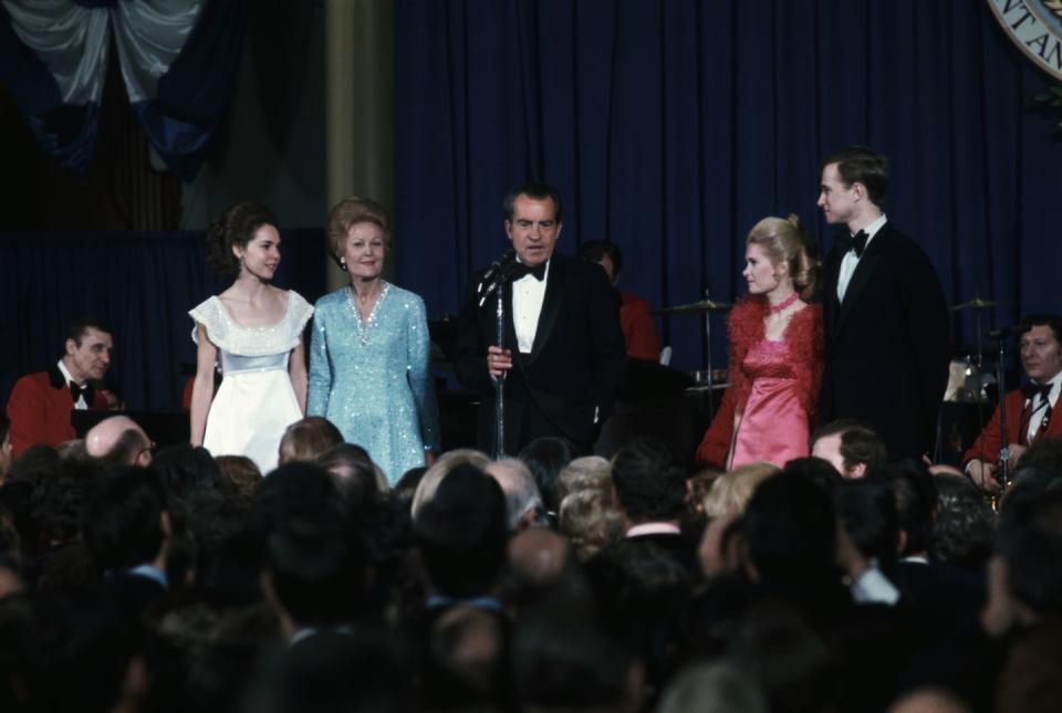 <p> At the beginning of Richard Nixon's second inaugural ball, the President gathered the First Family and the Vice President's family on stage for photographers, where he shared a few remarks. <a href="https://www.smithsonianmag.com/smithsonian-institution/when-was-first-inaugural-ball-180961863/" rel="nofollow noopener" target="_blank" data-ylk="slk:This tradition has continued;elm:context_link;itc:0;sec:content-canvas" class="link ">This tradition has continued</a> in the years since his presidency.</p>