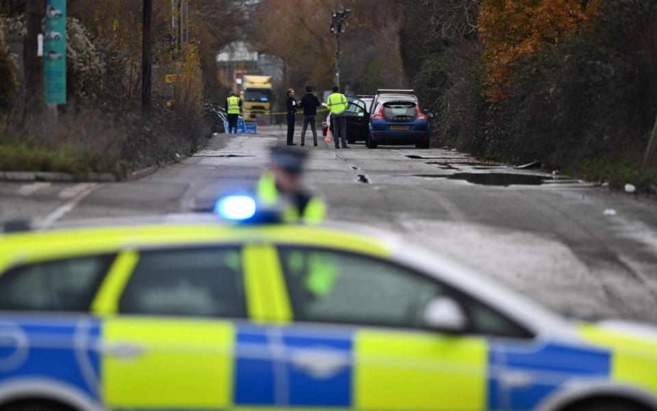 A police officer staffs a cordon as investigators work at a waste water treatment plant in Avonmouth, near Bristol  - BEN STANSALL/AFP 