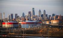 The Philadelphia Energy Solutions oil refinery owned by The Carlyle Group is seen in front of the Philadelphia skyline March 24, 2014. REUTERS/David M. Parrott