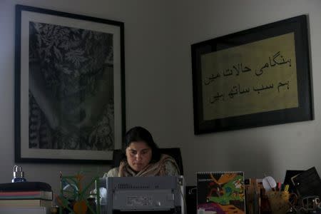 Pakistani journalist and filmmaker Sharmeen Obaid-Chinoy works on her computer at her office in Karachi, Pakistan, February 4, 2016. REUTERS/Akhtar Soomro