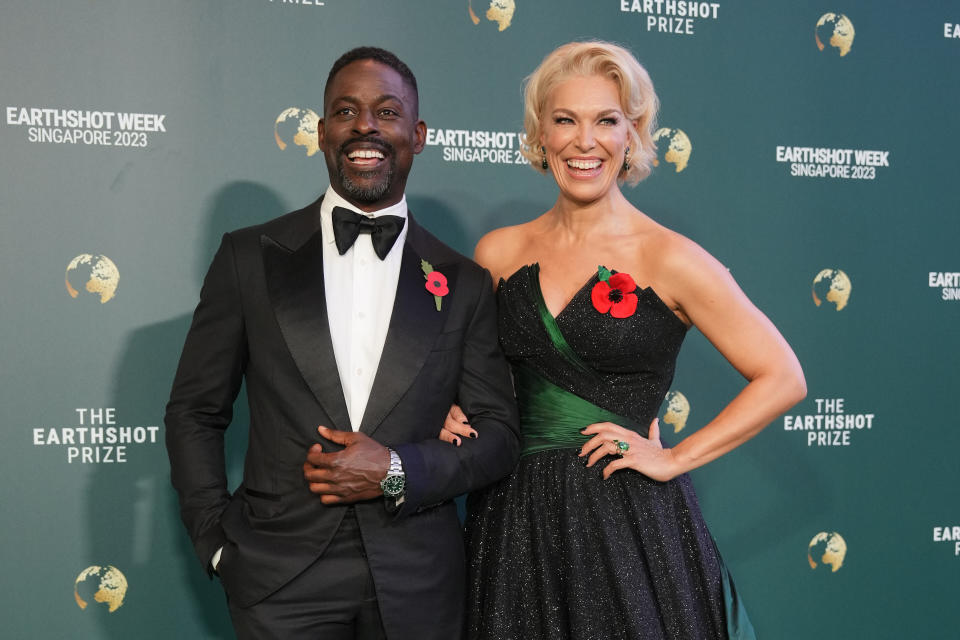 British actor Hannah Waddingham, right, and US actor Sterling K. Brown poses on the green carpet for the 2023 Earthshot Prize Awards in in Singapore, Tuesday, Nov. 7, 2023. (AP Photo/Vincent Thian)