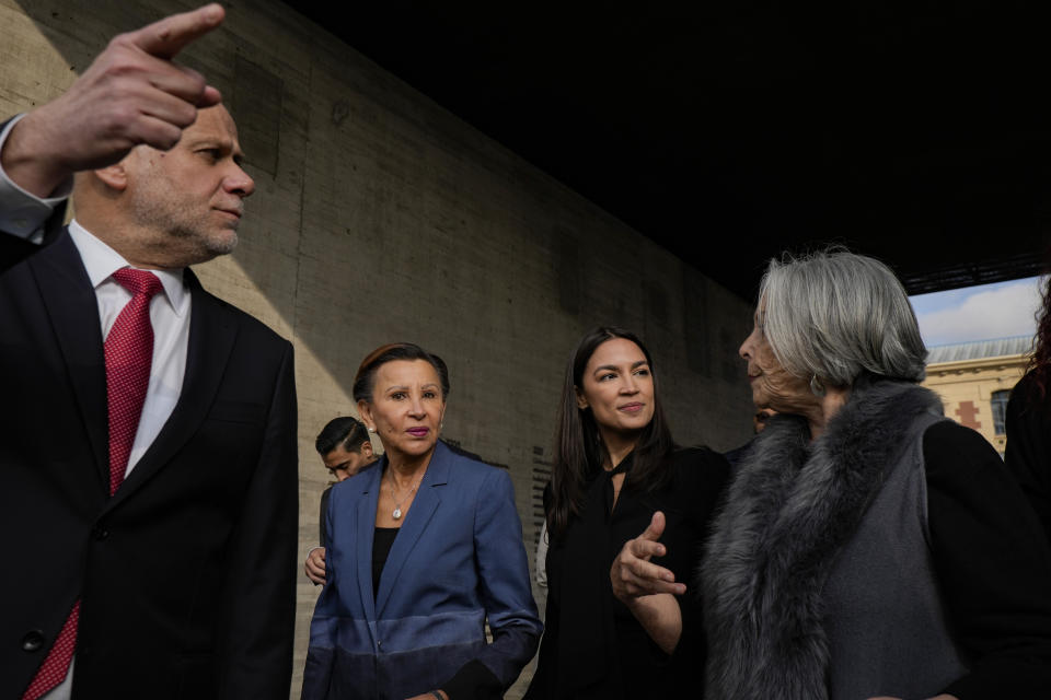 Congresswomen Nydia Velazquez, (D-NY), second left, and Alexandria Ocasio-Cortez, (D-NY), second right, are accompanied by Minister Alvaro Elizalde, General Secretary of the Presidency, left, and Marcia Scantlebury, president of the Memory and Human Rights Museum, right, during a visit to the museum, in Santiago, Chile, Thursday, Aug. 17, 2023. The two representatives are part of a US delegation who traveled to the South American country to learn about efforts to defend its democracy ahead of the 50th anniversary of the military coup led by Gen. Augusto Pinochet. (AP Photo/Esteban Felix)