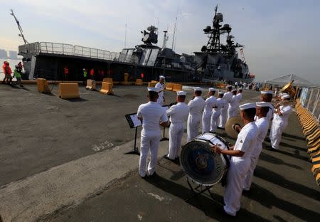 Philippine Navy band members play music to welcome the Russian Navy vessel Admiral Tributs, a large anti-submarine ship, as it docks at the south harbor port area in Metro Manila, Philippines, January 3, 2017. REUTERS/Romeo Ranoco