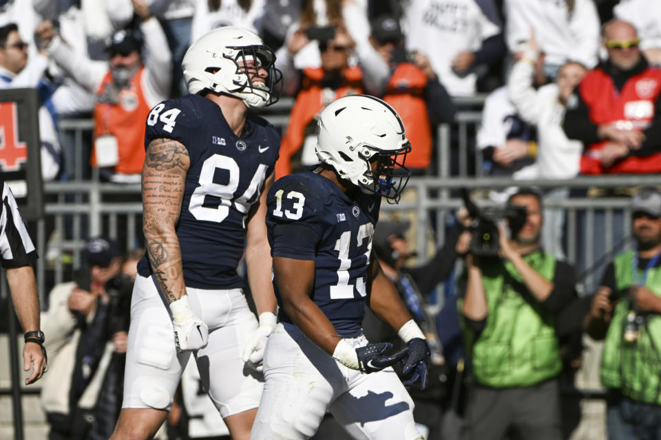 Penn State running back Kaytron Allen (13) and tight end Theo Johnson (84) will try to lead the Nittany Lions to a road win over Indiana on Saturday. (AP Photo/Barry Reeger)
