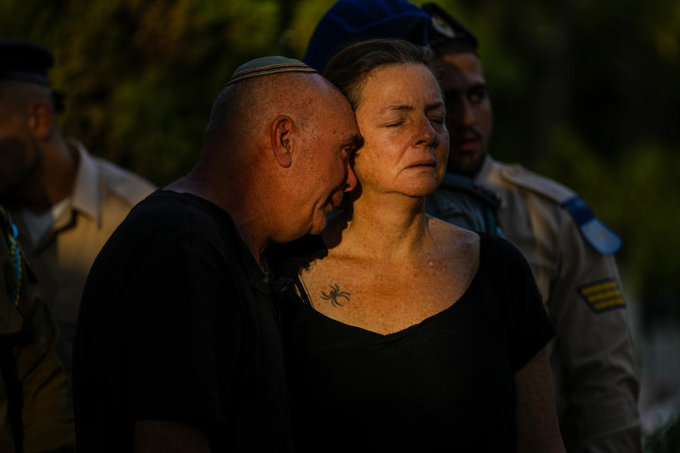 Doron and Tami, parents of Israeli reserve soldier captain Omri Yosef David mourn during his funeral in Carmiel, northern Israel, Wednesday, Nov. 15, 2023. David, 27, was killed during a military ground operation in the Gaza Strip. As the military sets its sights on southern Gaza in its campaign to stamp out Hamas, key challenges loom. International patience for a protracted invasion has begun to wear thin. And with some 2 million displaced Gaza residents staying in crowded shelters in the south in dire conditions, a broad military offensive there could unleash a new humanitarian disaster during the cold, wet winter. (AP Photo/Ariel Schalit)