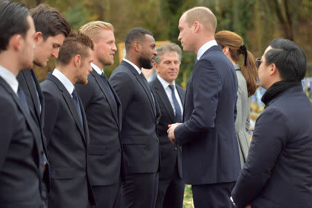 Britain's Prince William and Catherine, The Duchess of Cambridge, speak to Leicester City players and manager after viewing tributes to Leicester City's owner Thai businessman Vichai Srivaddhanaprabha, as his son Khun Aiyawatt Srivaddhanaprabha stands behind them, outside Leicester City's King Power stadium in Leicester, Britain, November 28, 2018. Arthur Edwards/Pool via REUTERS