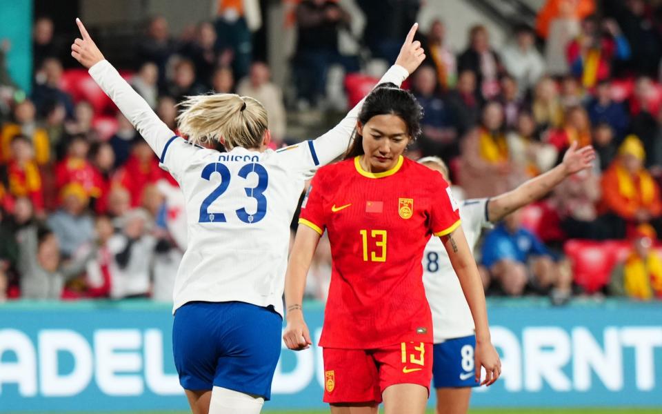 Alessia Russo of England celebrates scoring her goal past Lina Yang of China