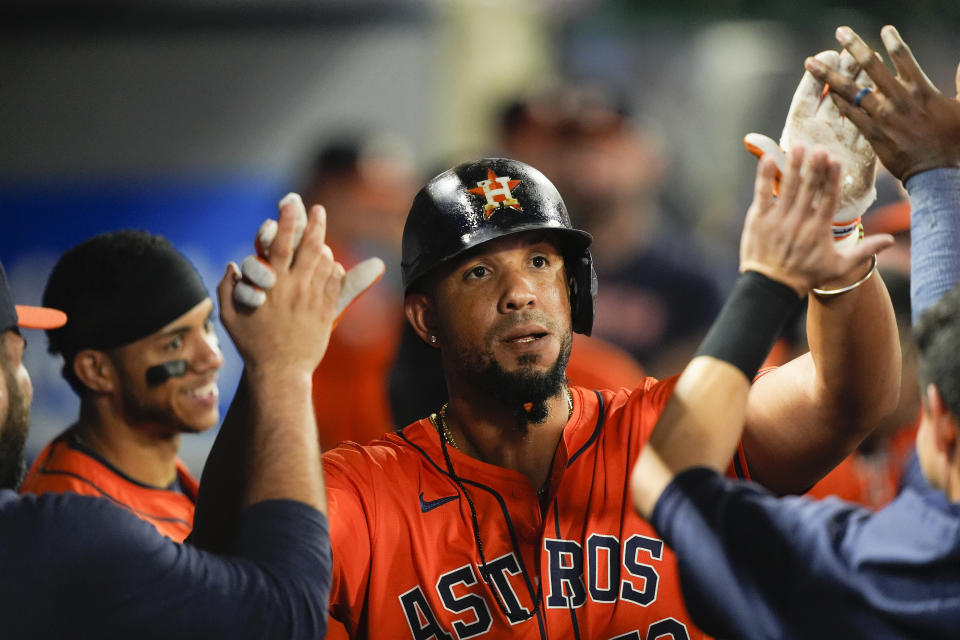 Houston Astros' Jose Abreu celebrates his solo home run in the dugout during the eighth inning of a baseball game against the Los Angeles Angels, Friday, June 7, 2024, in Anaheim, Calif. (AP Photo/Ryan Sun)