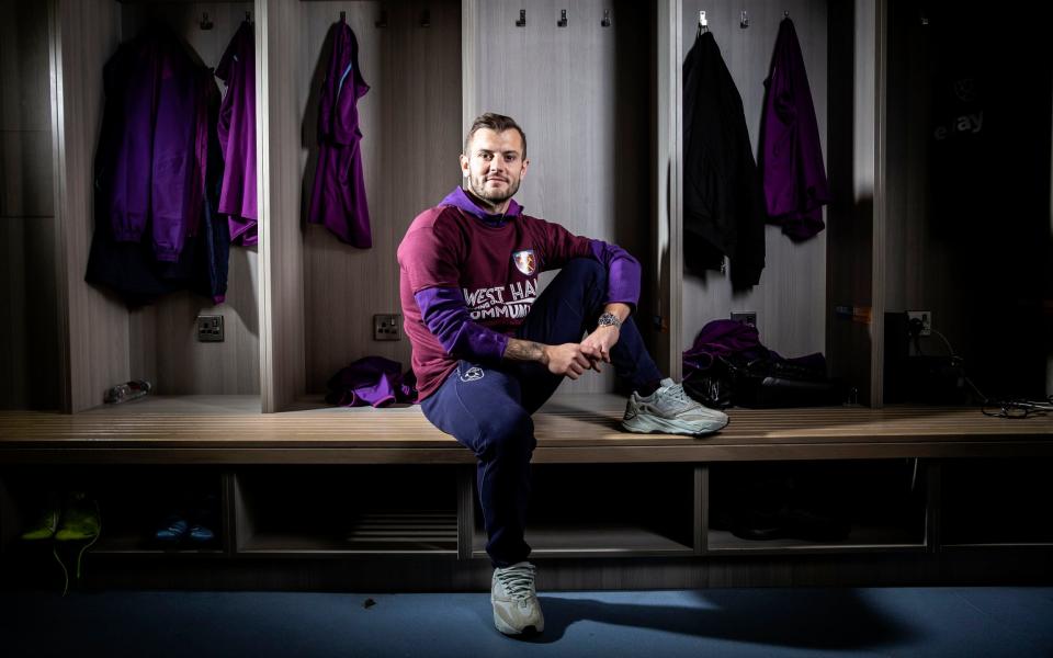 Jack Wilshere sits in the West Ham first-team changing room - Jeff Gilbert