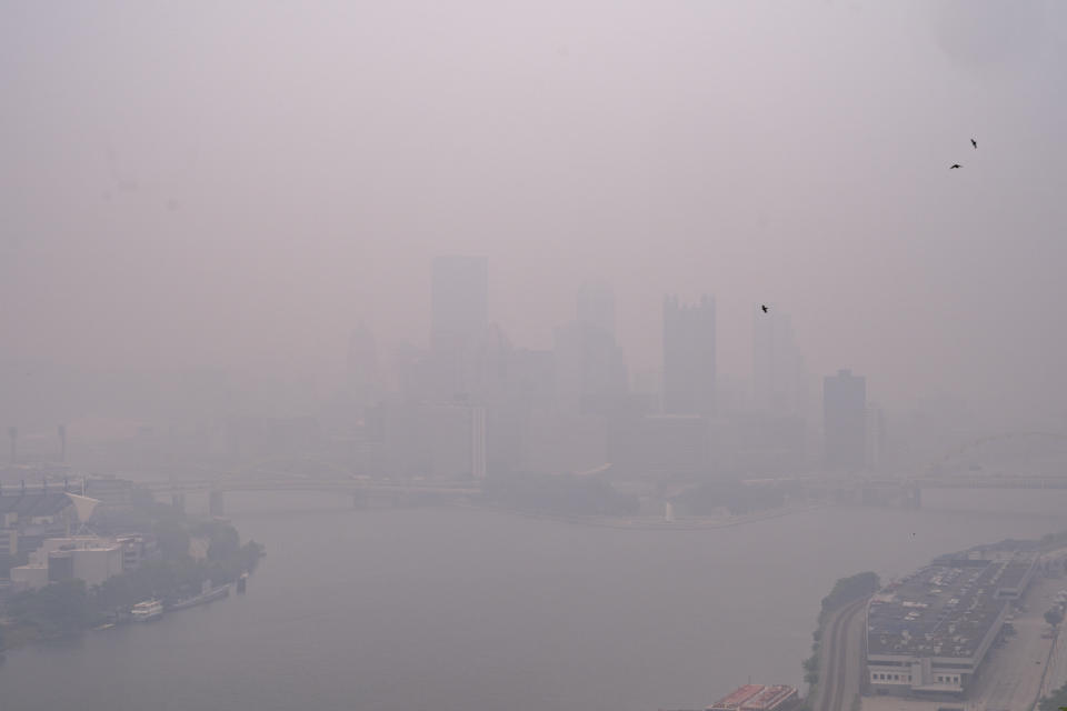 Haze from Canadian wildfires blankets the downtown Pittsburgh skyline as seen from West End Overlook in Elliott, Pa., Wednesday, June 28, 2023. (Benjamin B. Braun/Pittsburgh Post-Gazette via AP)