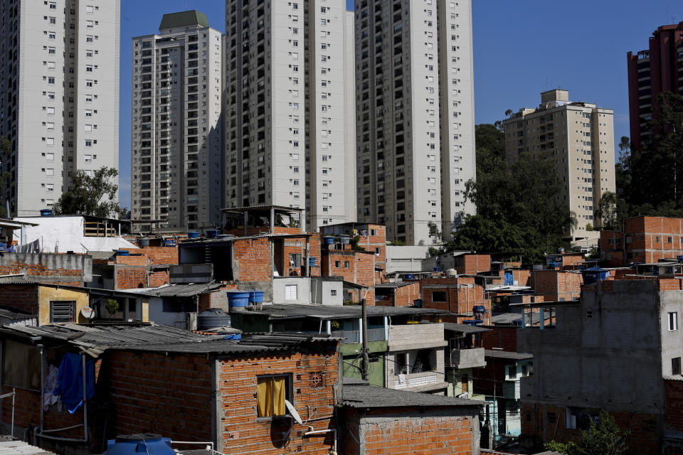 This May 22, 2019 photo shows brick and block brick houses of the sprawling slum neighborhood of Paraisopolis stacked next to the posh Morumbi neighborhood, in Sao Paulo, Brazil. A study released this month by the Getulio Vargas Foundation found that the key measure of income inequality has reached its highest level since the series began seven years ago, with Brazil among the most unequal nations in a broader region where the gap between rich and poor is notorious. (AP Photo/Victor R. Caivano)