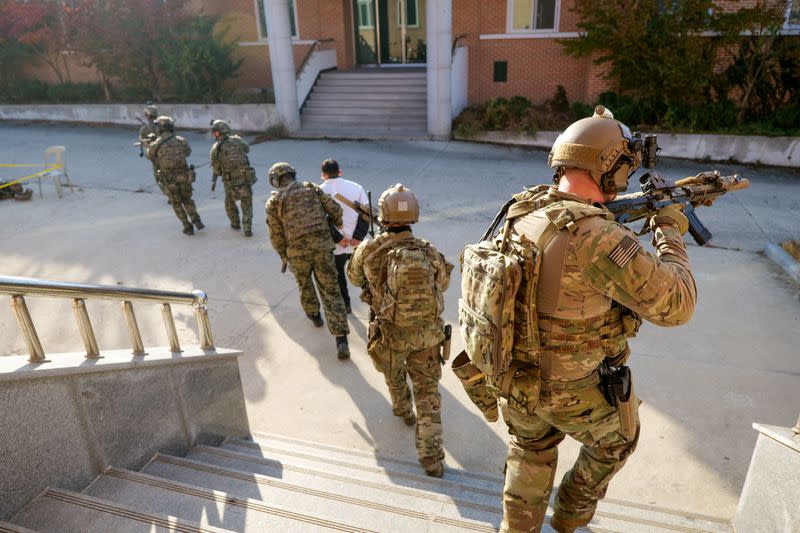 Members of South Korea and U.S. Special forces take part in a joint military exercise conducted by South Korean and U.S. special forces troops at Gunsan Air Force base in Gunsan