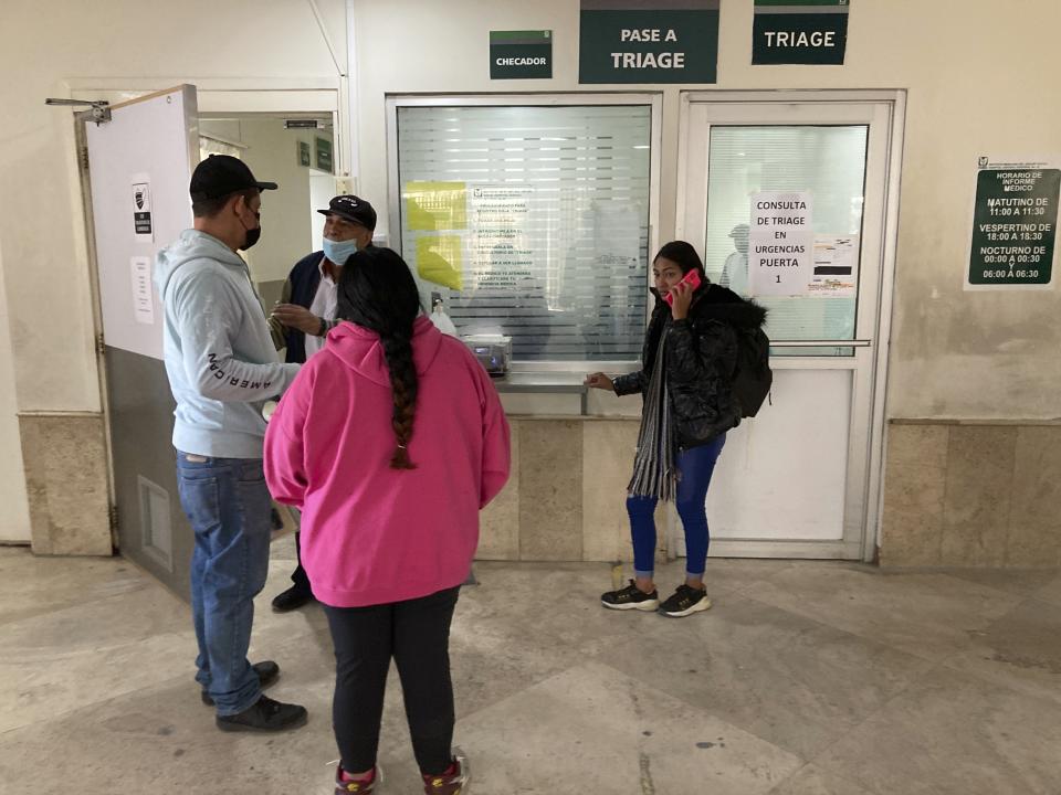 Migrant Stefany Arango Morillo of Maracaibo, Venezuela, right, talks to relatives on her mobile phone from a public hospital in Ciudad Juarez, Mexico, Wednesday, March 29, 2023. Arango Morillo provided information about her injured brother Stefan Arango Morillo who suffered serious injury from smoke inhalation while interned at a detention center for migrants that caught fire in Ciudad Juarez. (AP Photos/Morgan Lee)