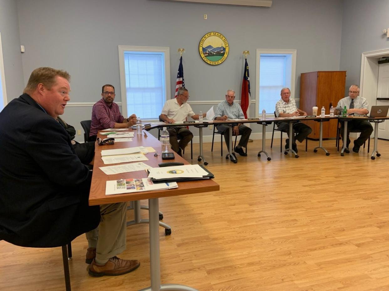 The Mars Hill Town Board adopted a resolution in which the town renamed the main trail at Bailey Mountain Preserve and Park after Richard L Hoffman, a former adminsitrator at Mars Hill College.