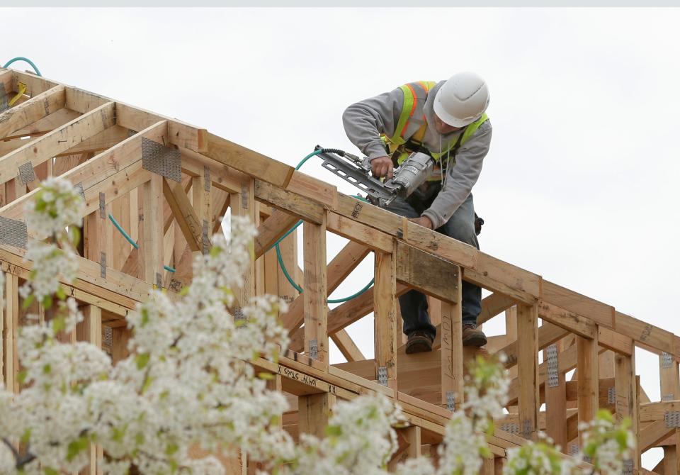 Work is done on an apartment building under construction in Sacramento on Feb. 8, 2019.