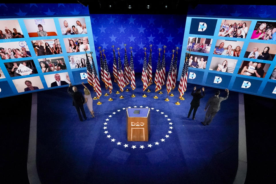 Democratic presidential candidate former Vice President Joe Biden, left, his wife Jill Biden, second from left, Democratic vice presidential candidate Sen. Kamala Harris, D-Calif., second from right, and her husband Doug Emhoff, right, wave to supporters after Biden spoke during the fourth day of the Democratic National Convention, Thursday, Aug. 20, 2020, at the Chase Center in Wilmington, Del. (AP Photo/Andrew Harnik)