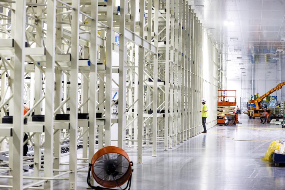 A construction worker checks in on equipment installation at Ultium Cells in Spring Hill, Tenn. on Thursday, Aug. 3, 2023.