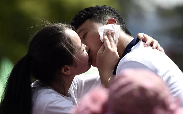 In previous years, couples have taken part in "kiss contests" to welcome Qixi - Xinhua/Photoshot