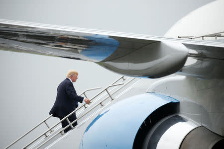 U.S. President Donald Trump boards Air Force One prior to departing Morristown Municipal Airport en route Camp David, Maryland, where he'll meet with his national security team to discuss a U.S. security strategy for South Asia that includes sending more U.S. soldiers to Afghanistan, in Morristown, New Jersey, U.S., August 18, 2017. REUTERS/Kevin Lamarque