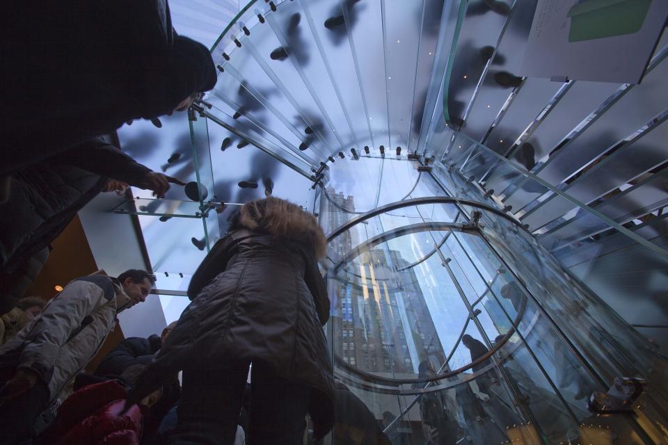 Shoppers are pictured inside an Apple store on 5th Ave during Black Friday Sales in New York