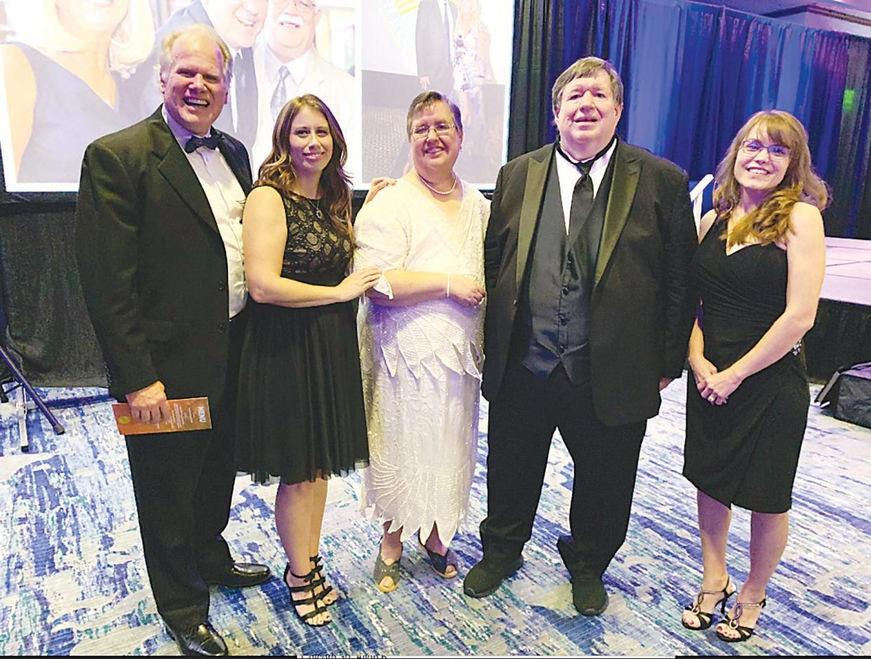 Former E-E Publisher Matt Pearson, left, Jamie Unkenholz, Pam Tupa, Mike Tupa and Jennifer Curry on the night Mike Tupa was inducted into the Bartlesville Athletic Hall of Fame in 2019.