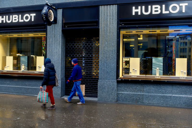 People walk past a shop of LVMH's Hublot watch brand in Zurich