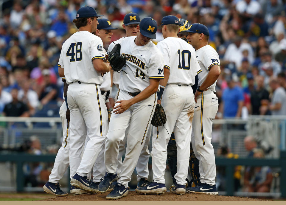 Michigan pitcher Benjamin Keizer (14) is pulled in the sixth inning against Vanderbilt in Game 2 of the NCAA College World Series baseball finals in Omaha, Neb., Tuesday, June 25, 2019. Vanderbilt won 4-1 to tie the series at one apiece. (AP Photo/John Peterson)