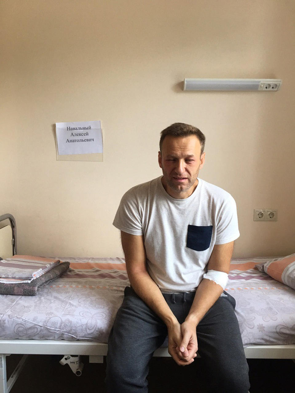 This Monday, July 29, 2019 handout photo released by navalny.com shows Alexei Navalny, Russia's most prominent opposition figure, sitting on a bed in a hospital, in Moscow, Russia. Russian opposition leader Alexei Navalny was discharged from a hospital Monday even though his physician raised suspicions of a possible poisoning after he suffered facial swelling and a rash while in jail. (navalny.com via AP)