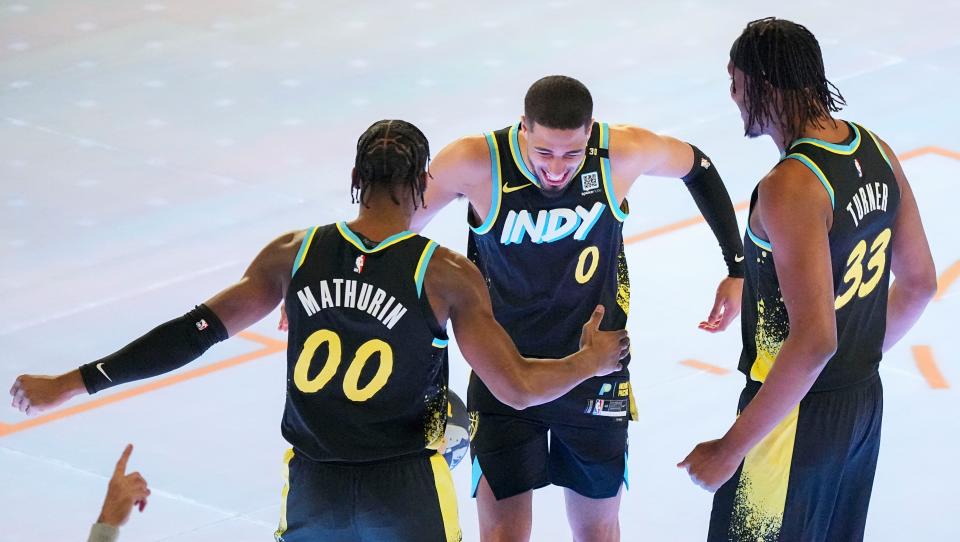 Indiana Pacers guard Bennedict Mathurin (00) and Indiana Pacers center Myles Turner (33) celebrate with Indiana Pacers guard Tyrese Haliburton (0) after running the skills competition Saturday, Feb. 17, 2024, during NBA All-Star Saturday Night at Lucas Oil Stadium in downtown Indianapolis.