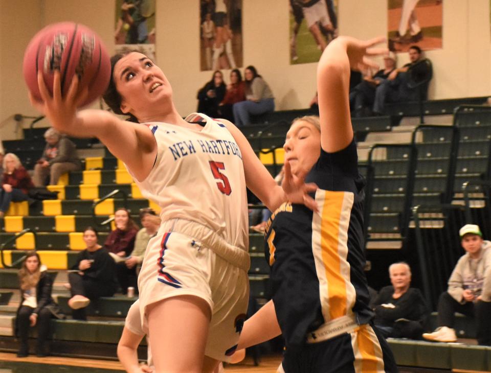 New Hartford Spartan Danielle Lucas attempts a layup against Utica-Notre Dame Sunday during the second half of a game at the Utica Board of Officials for Women's Basketball Cancer Challenge. New Hartford and Notre Dame squared off in the third of foiur games at Herkimer College.