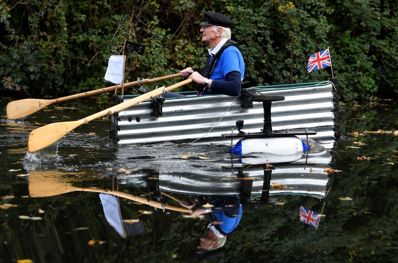 80-year old military veteran Stanley rows homemade boat named the "Tintanic" to raise funds for charity St Wilfrid's Hospice, in Chichester