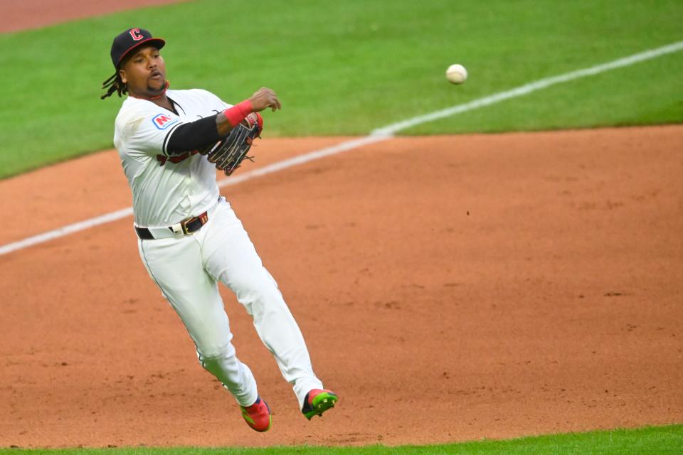 Cleveland Guardians third baseman Jose Ramirez (11) throws to first base in the eighth inning Monday against the Detroit Tigers in Cleveland.