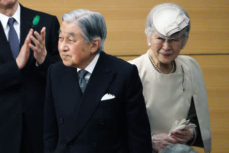 Japan's Emperor Akihito and Empress Michiko greet the guests as they leave from the stage after the awarding ceremony of the Midori Academic Prize Friday, April 26, 2019, in Tokyo. Eugene Hoshiko/Pool via REUTERS