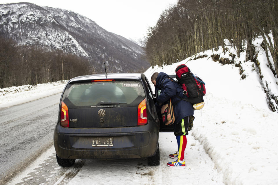 Venezuelan Yeslie Aranda, 57, hitchhikes on Route 3, as he fulfills his promise to travel throughout South America with one leg and a prosthesis, between Tolhuin and Ushuaia, Argentina, Saturday, Aug. 17, 2019. Last year, the former bus driver decided it was time to leave a legacy by traveling the whole length of the South American continent. (AP Photo/Luján Agusti)