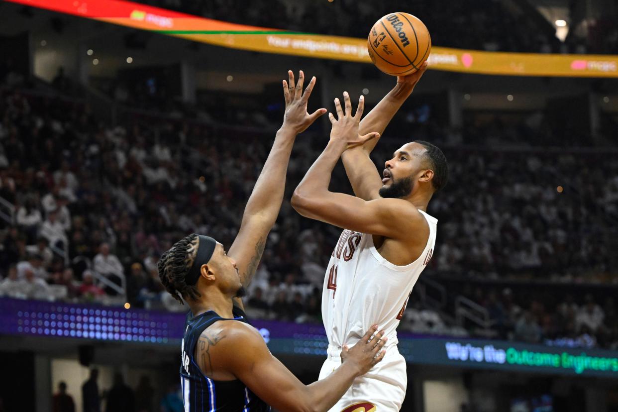 Apr 20, 2024; Cleveland, Ohio, USA; Cleveland Cavaliers forward Evan Mobley (4) shoots beside Orlando Magic center Wendell Carter Jr. (34) in the second quarter during game one of the first round for the 2024 NBA playoffs at Rocket Mortgage FieldHouse. Mandatory Credit: David Richard-USA TODAY Sports