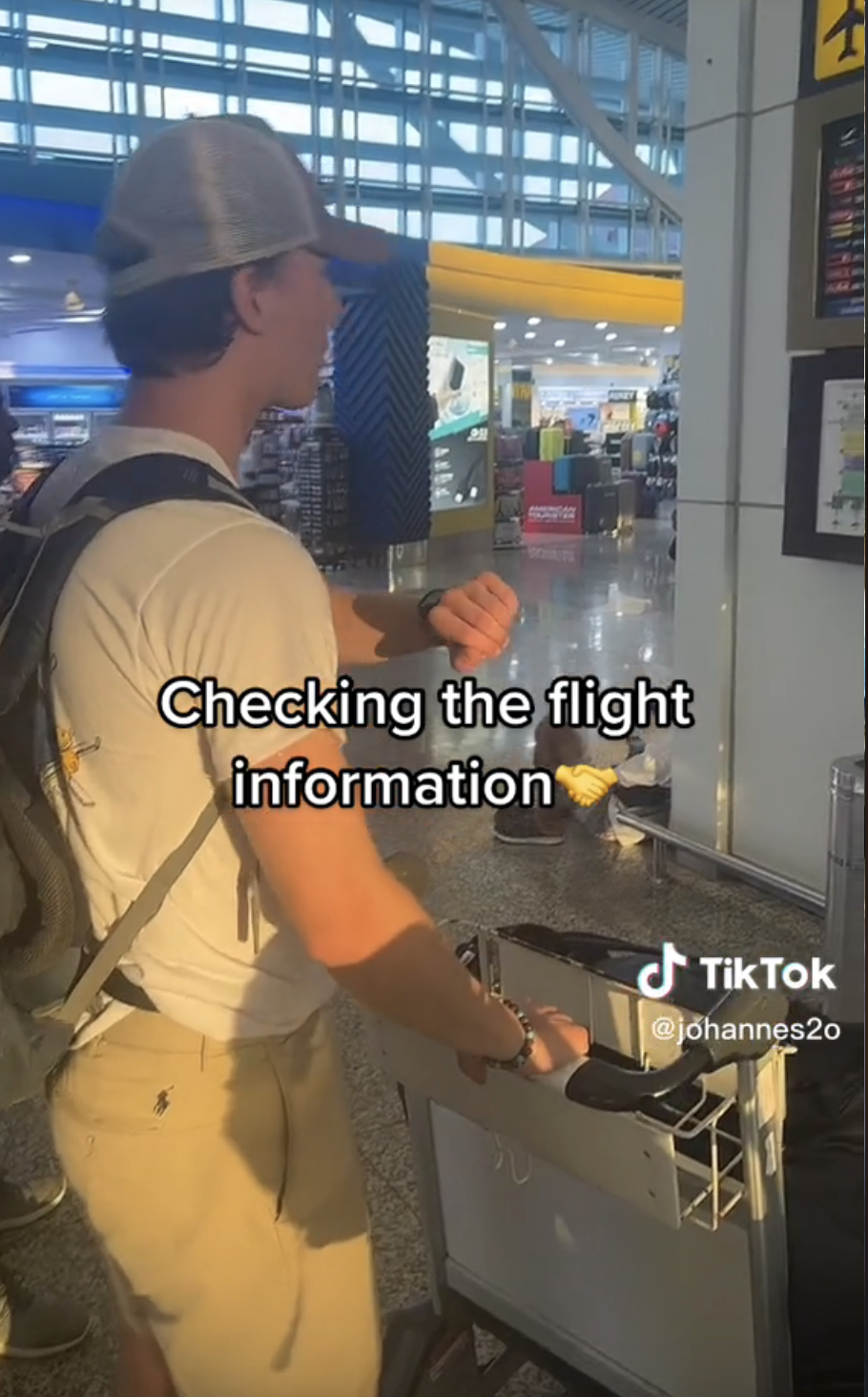 Screenshot of Airport Dad on TikTok with caption "Checking the flight information"