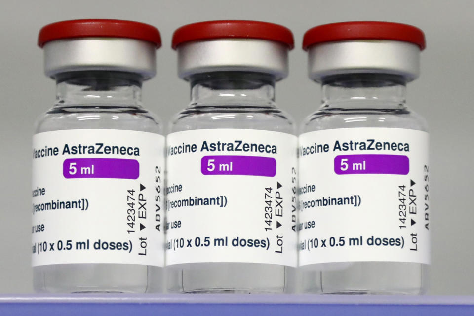 FILE - In this file photo dated Monday, March 22, 2021, vials of the AstraZeneca COVID-19 vaccine in a fridge at the local vaccine center in Ebersberg near Munich, Germany. German officials have decided to limit the use of AstraZeneca’s coronavirus vaccine in people under 60 after more unusual blood clots were reported in a small number of people who received the shots. Earlier this month, more than a dozen countries, including Germany, suspended their use of AstraZeneca over the blood clot issue. (AP Photo/Matthias Schrader, File)