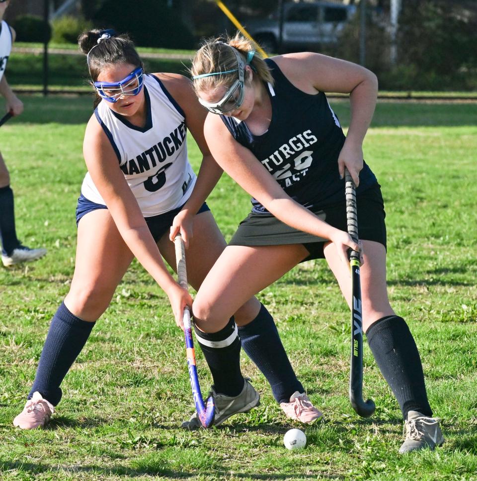 SOUTH YARMOUTH   10/19/22    Lily Remick of Nantucket reaches around Shannon Keating of Sturgis East .