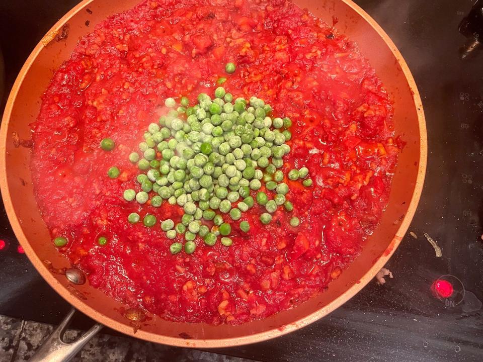 Adding peas to Cascatelli ragu