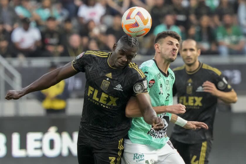 Los Angeles FC defender Jesús Murillo (3) challenges León midfielder Lucas Di Yorio, front right.