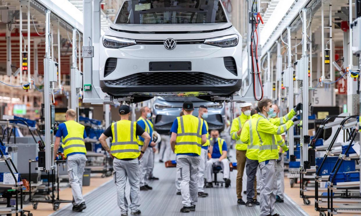 <span>Employees work at the assembly line on the VW ID 4 electric car at Emden, northern Germany.</span><span>Photograph: David Hecker/AFP/Getty Images</span>