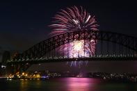 SYDNEY, AUSTRALIA - DECEMBER 31: Fireworks light up the sky during the nine o'clock show during New Years Eve celebrations on Sydney Harbour on December 31, 2012 in Sydney, Australia. (Photo by Cameron Spencer/Getty Images)
