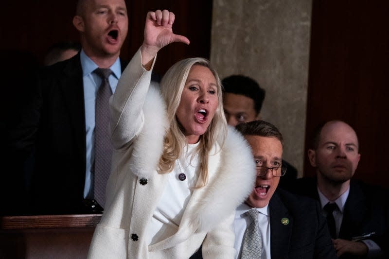 Rep. Marjorie Taylor Greene, R-Ga., gives a thumbs down during President Joe Bide’s State of the Union address in the House Chamber of the U.S. Capitol on Tuesday, February 7, 2023. 