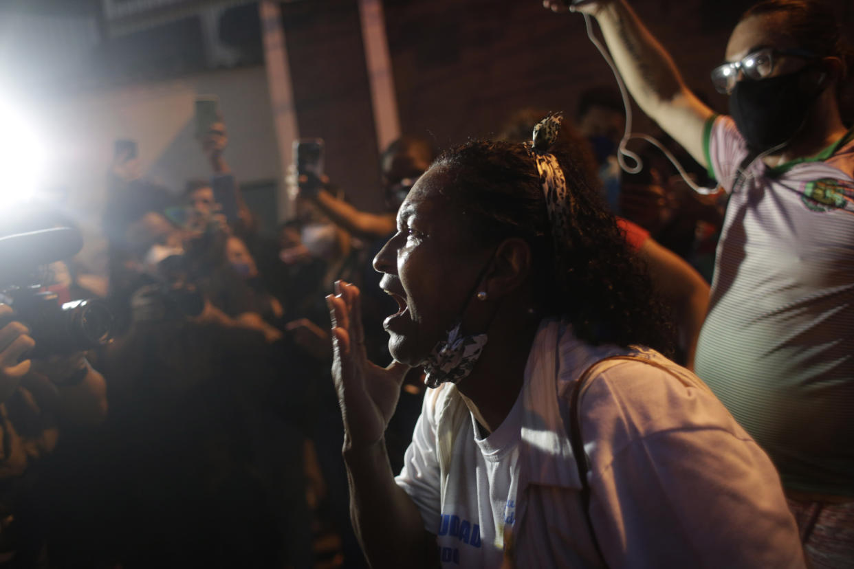 A family member screams during a protest against the killing of Kathlen Romeu, a young pregnant woman killed by a stray bullet, in Rio de Janeiro, Brazil, Wednesday, June 9, 2021. Stray bullets have struck at least six pregnant women in Rio since 2017, but Romeu was the first to die, according to Crossfire, a non-governmental data project that tracks armed violence. (AP Photo/Bruna Prado)