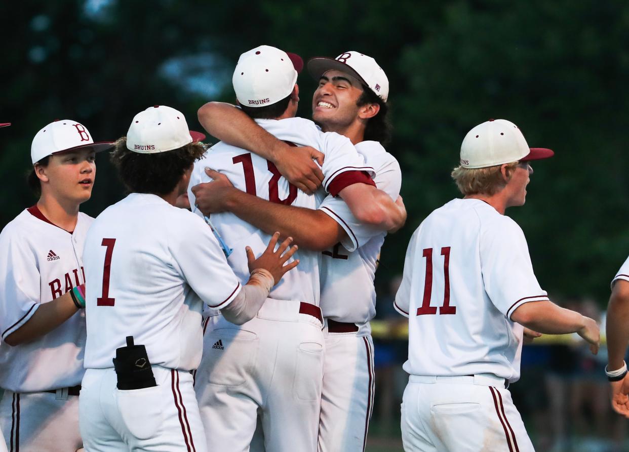 Ballard's Kaine Samuels (22) embraced teammate Lucas Niemeyer (18) after they defeated Eastern to win the 28th District finals at the Christian Academy of Louisville ballfield in Louisville, Ky. on May. 20, 2024. They won 9-4.