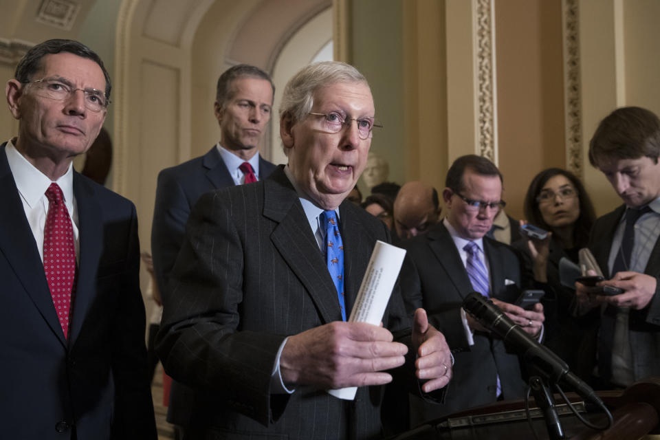 Senate Majority Leader Mitch McConnell, R-Ky., center, joined from left by Sen. John Barrasso, R-Wyo., and Sen. John Thune, R-S.D., speaks to reporters about the possibility of a partial government shutdown, at the Capitol in Washington, Tuesday, Dec. 18, 2018. Congress and President Donald Trump continue to bicker over his demand that lawmakers fund a wall along the U.S.-Mexico border, pushing the government to the brink of a partial shutdown at midnight Friday. (AP Photo/J. Scott Applewhite)